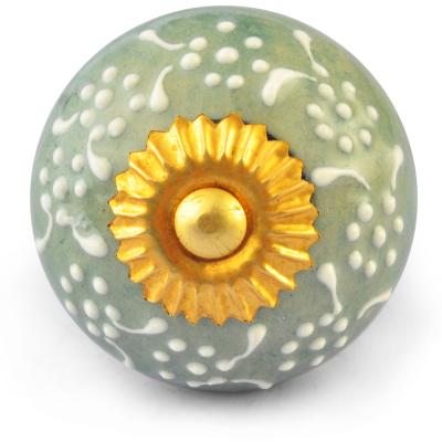 White Embossed design on Lime Green Ceramic knob White Embossed design on Lime Green Ceramic knob