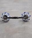 Blue Floral Design on a White Cabinet Knob