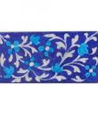 Turquoise flower and blue tile.