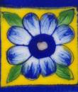 Blue bordered yellow tile wih blue flower