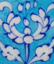 white floral on turquoise tile